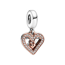 Load image into Gallery viewer, Heart-shaped charm with rose gold and silver finish on a white background