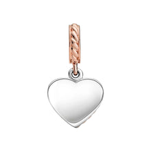 Load image into Gallery viewer, Heart-shaped pendant with rose gold and silver accents on a white background