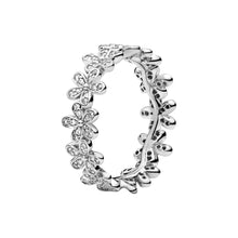 Load image into Gallery viewer, Silver ring with floral designs on a white background