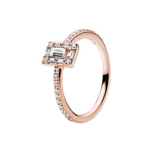 Load image into Gallery viewer, Rose gold ring with emerald-cut diamond and smaller diamonds on a white background