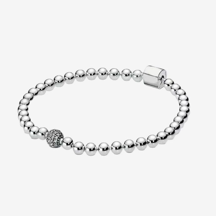 Silver beaded bracelet with a clasp on a white background