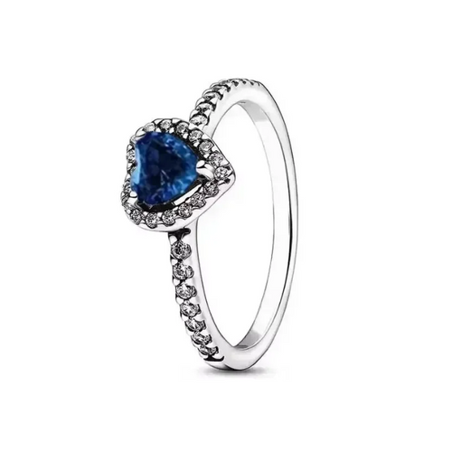 Silver ring with a blue gemstone on a white background