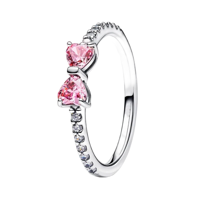Silver ring with pink heart-shaped stones on a white background