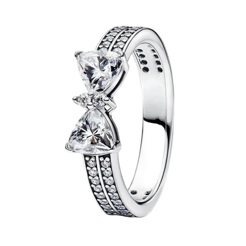 Silver ring with two triangular gemstones on a white background