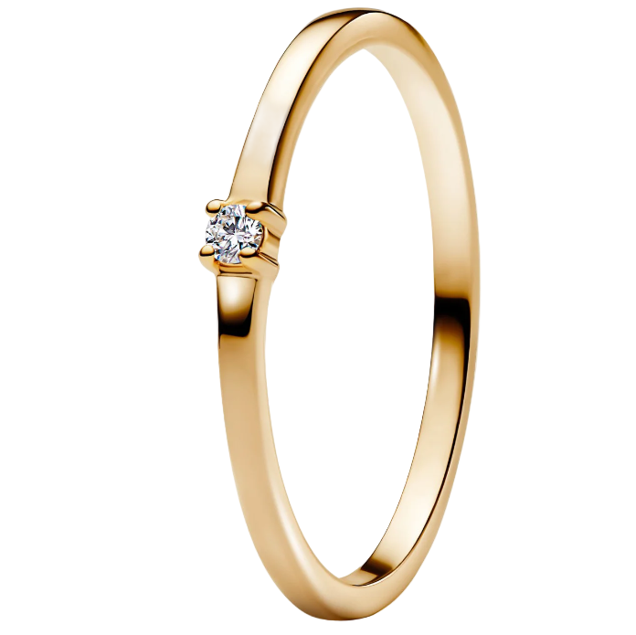 Gold ring with a diamond on a white background