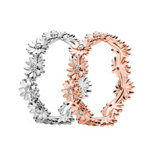 Load image into Gallery viewer, Two floral hoop earrings, one silver and one rose gold, on a white background.

