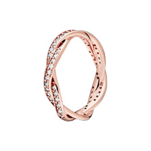 Load image into Gallery viewer, Rose gold ring with diamond accents on a white background
