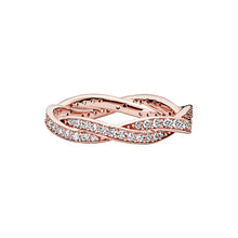 Load image into Gallery viewer, Rose gold ring with diamond accents on a white background
