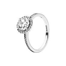 Load image into Gallery viewer, Silver ring with a large central gemstone and smaller stones on a white background
